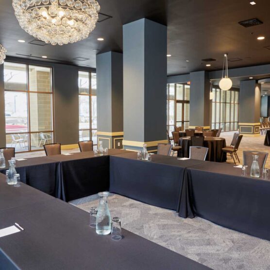 u shaped meeting table surrounded by chairs