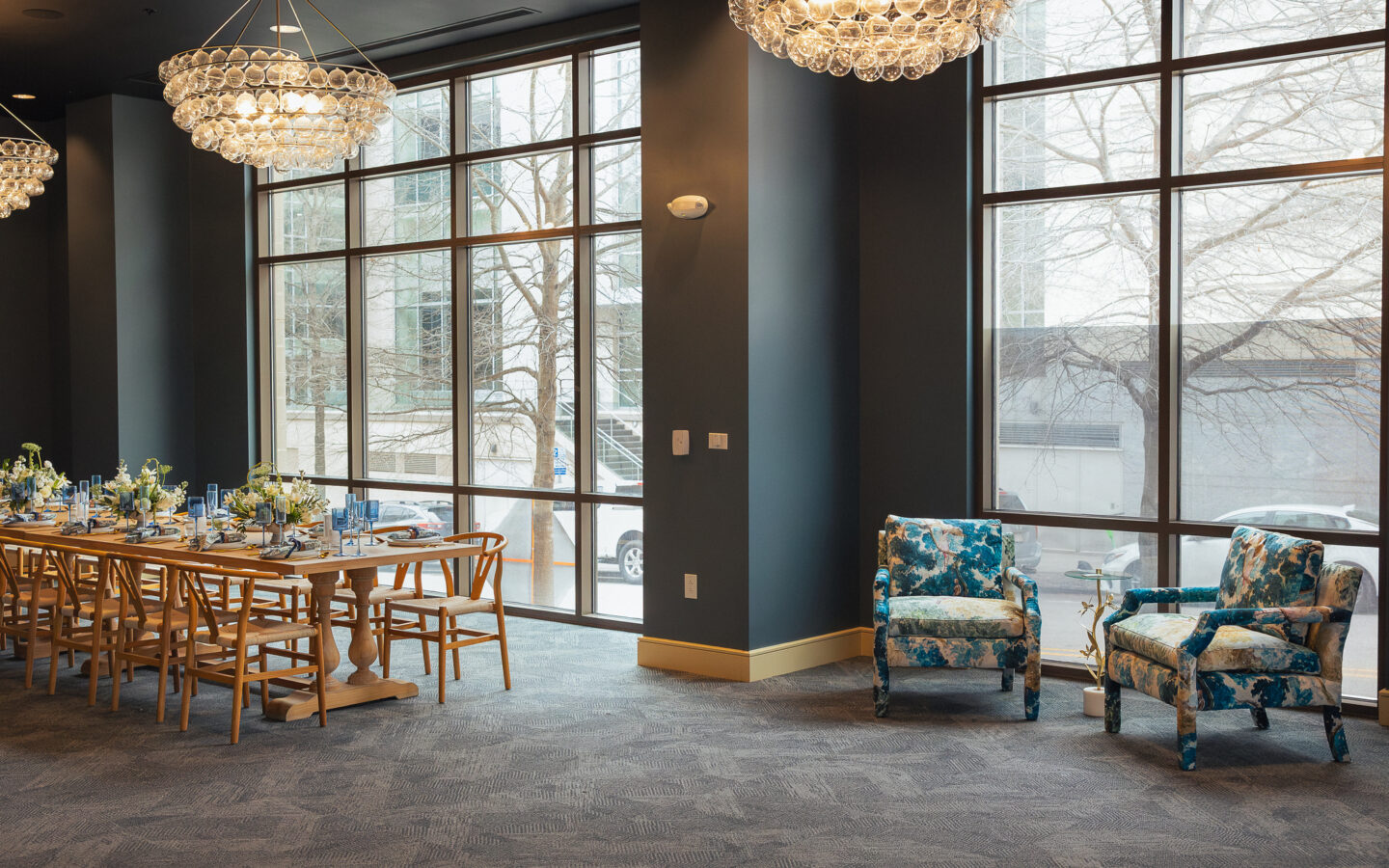 a large dining room with a chandelier hanging from the ceiling