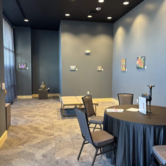 round tables and chairs set up in a large room